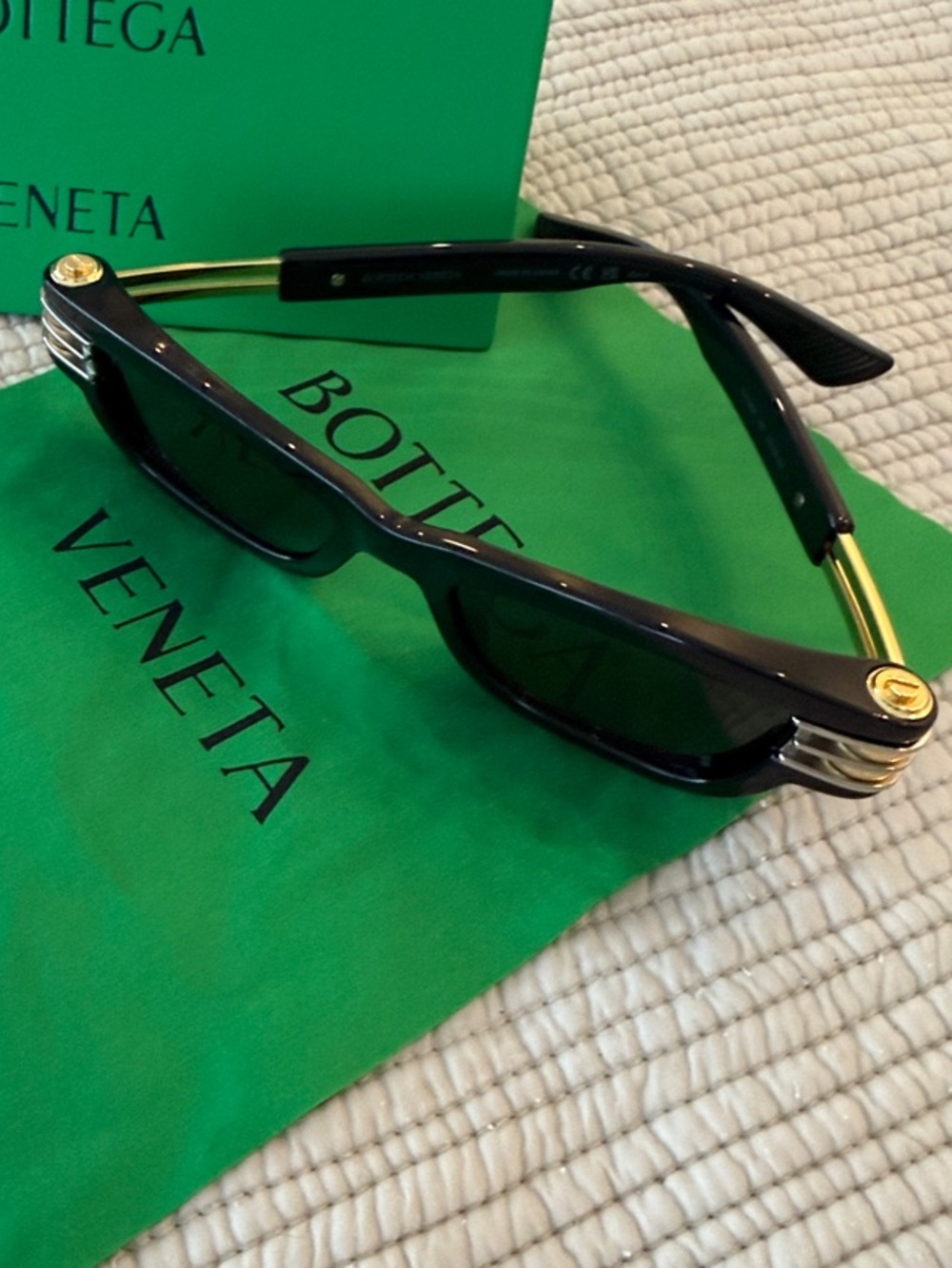 Be summer ready with Bottega Veneta Black Sunglasses with Gold Accents